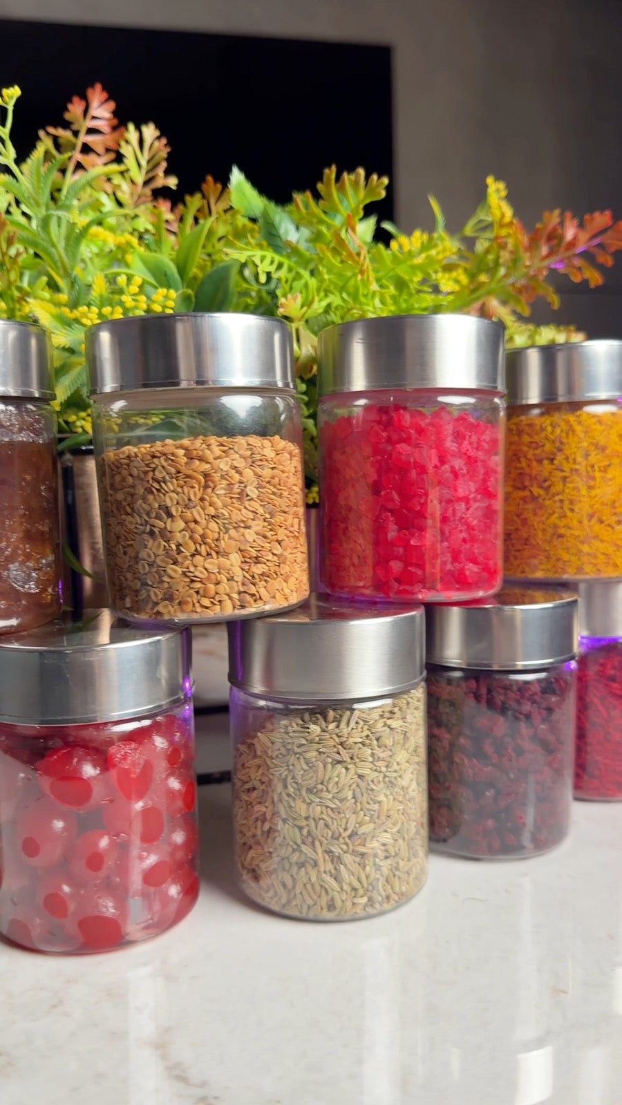 Jars of cherry, tutti frutti, fruit candy and dates